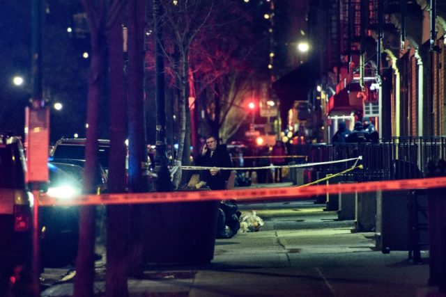 The taped-off area marking the scene of a shooting in Harlem, New York is seen on January