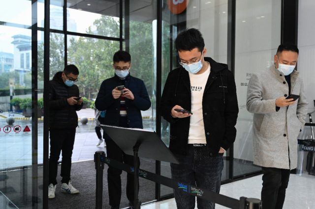 Across China, scanning a "green" health code app is a must for entering shops, offices and public transport