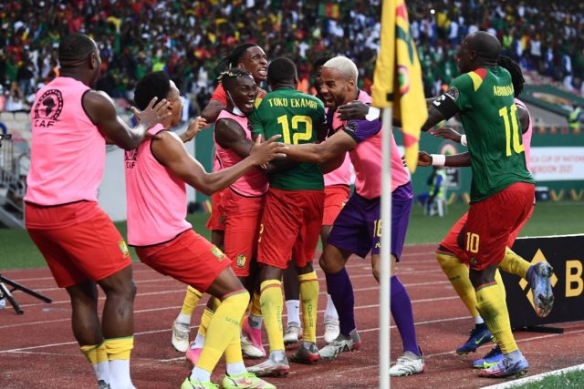 Cameroon players celebrate after Karl Toko-Ekambi scored his and his team's second goal ag