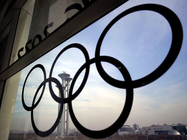The Olympic rings are displayed at the main media center for the Beijing Winter Olympics on Tuesday, Jan. 18, 2022, in Beijing. (AP Photo/David J. Phillip, File)