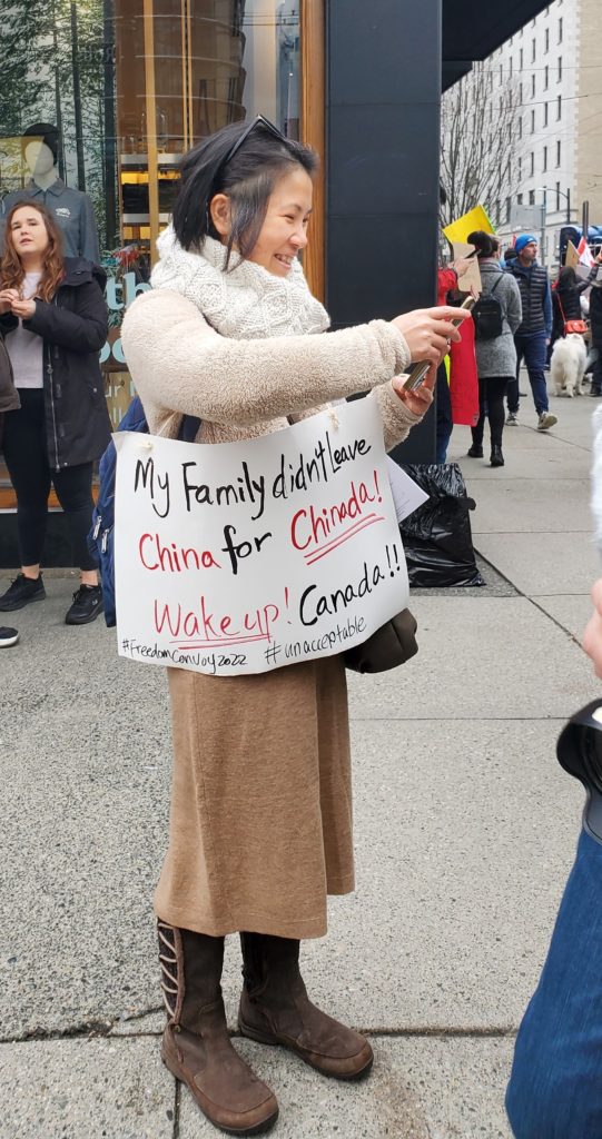 A protester makes her point in Vancouver (Ethan Letkeman/Breitbart News)