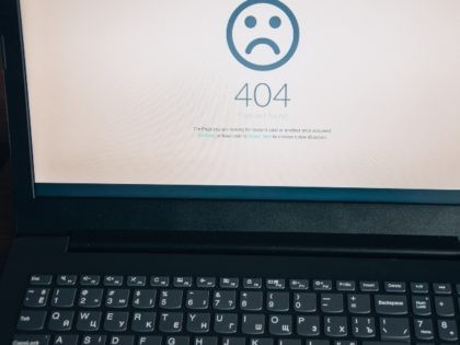 A laptop displaying a 404 error