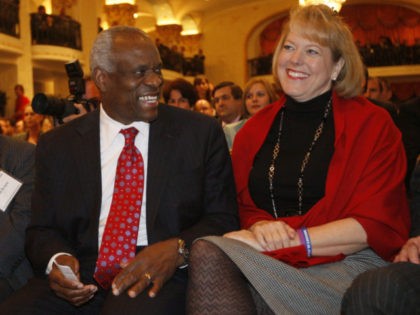 FILE - In this Nov. 15, 2007 file photo, Supreme Court Justice Clarence Thomas sits with his wife Virginia Thomas in Washington. With their Ivy League pedigrees and East Coast addresses, Supreme Court justices often are rightly described as unrepresentative of the nation. But in one area, the justices look …