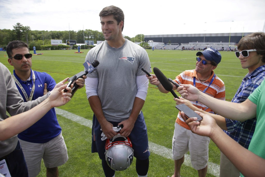 Formerly a New England Patriots defensive end Jake Bequette, in camp this years as a tight end, talks with reporters during a media availability after an NFL football minicamp Wednesday, June 17, 2015, in Foxborough, Mass. (AP Photo/Stephan Savoia)