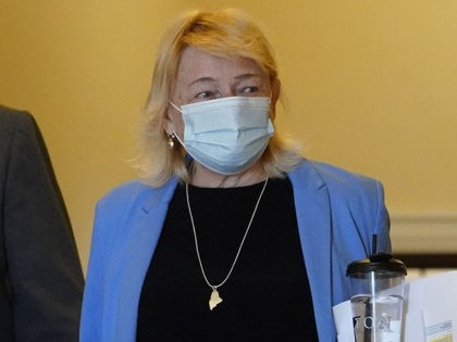 Gov. Janet Mills wears a face covering while walking through the halls of the State House, Wednesday, June 2, 2021, in Augusta, Maine. (AP Photo/Robert F. Bukaty)