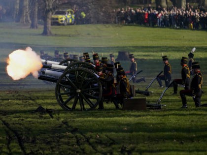 Fire shrouds the scene as The King's Troop Royal Horse Artillery fire gun salutes to mark the 70th anniversary of the accession to the throne of Britain's Queen Elizabeth, in Green Park beside Buckingham Palace, London, Monday, Feb. 7, 2022. Queen Elizabeth II acceded to the throne on the death …