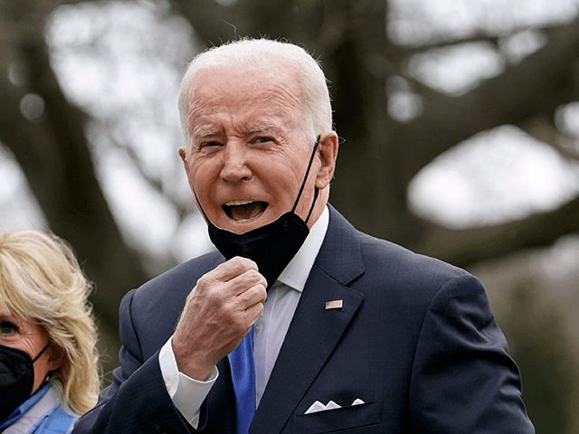 President Joe Biden wishes members of the press a happy Valentine's Day as he and first lady Jill Biden walk on the South Lawn of the White House after stepping off Marine One, Monday, Feb. 14, 2022, in Washington. The Bidens are returning to Washington after spending the weekend at …