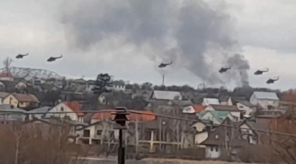 In this handout photo taken from video released by Ukrainian Police Department Press Service, Military helicopters apparently Russian, fly over the outskirts of Kyiv, Ukraine, Thursday, Feb. 24, 2022. Russian troops have launched their anticipated attack on Ukraine. Big explosions were heard before dawn in Kyiv, Kharkiv and Odesa as world leaders decried the start of an Russian invasion that could cause massive casualties and topple Ukraine's democratically elected government. (Ukrainian Police Department Press Service via AP)