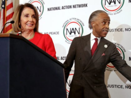 WASHINGTON, DC - NOVEMBER 14: Rev. Al Sharpton (R) welcomes House Minority Leader Nancy Pelosi (D-CA) to the podium during a post-midterm election meeting of Sharpton's National Action Network in the Kennedy Caucus Room at the Russell Senate Office Building on Capitol Hill November 14, 2018 in Washington, DC. Politicians …
