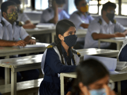 Students attend their class at the Rajuk Uttara Model College in Dhaka on September 12, 2021, as Bangladesh schools reopened after 18 months in one of the world's longest shutdowns due to the Covid-19 coronavirus pandemic. (Photo by Munir Uz zaman / AFP) (Photo by MUNIR UZ ZAMAN/AFP via Getty …