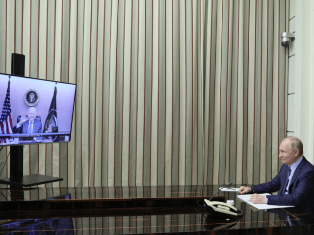Russian President Vladimir Putin attends a meeting with US President Joe Biden via a video