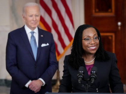WASHINGTON, DC - FEBRUARY 25: U.S. President Joe Biden (L) looks on as Ketanji Brown Jackson, circuit judge on the U.S. Court of Appeals for the District of Columbia Circuit, delivers brief remarks as his nominee to the U.S. Supreme Court during an event in the Cross Hall of the …