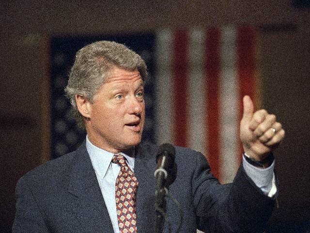 Democratic presidential nominee Bill Clinton gives the thumbs up sign as he speaks to a gathering at the University of Toledo in Toledo, Ohio, Oct. 29, 1992. Clinton said that President Bush’s view of the U.S. economy shows his “low standards” and “says something worse about his presidency” than any political opponent ever could. (AP Photo/J. Scott Applewhite)