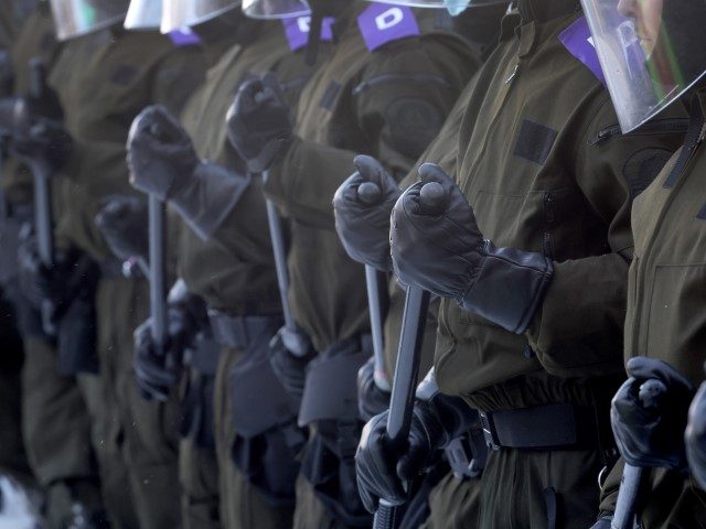 OTTAWA, ONTARIO - FEBRUARY 19: Police face off with demonstrators participating in a prote