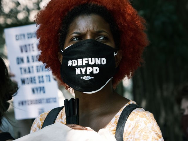 Activists, local politicians and families of those killed by the police hold a rally in front of City Hall to demand that the New York City Council vote against a budget that doesn't make enough cuts to the police department on June 29, 2021 in New York City.(Photo by Spencer …