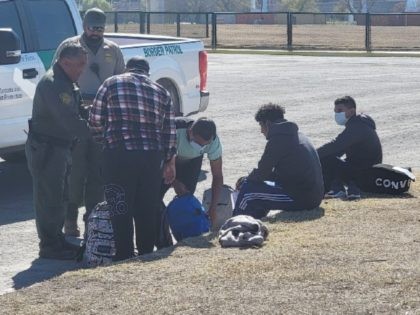 Eagle Pass Station agents apprehend a group of migrants after they illegally crossed the border from Mexico. (Bob Price/Breitbart Texas