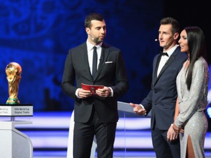 MOSCOW, RUSSIA - DECEMBER 01: Russian TV host Ivan Urgant (L), trophy bearer, Miroslav Klose, and Russian singer Alsou (L) during the Final Draw for the 2018 FIFA World Cup Russia at the State Kremlin Palace on December 1, 2017, in Moscow, Russia.