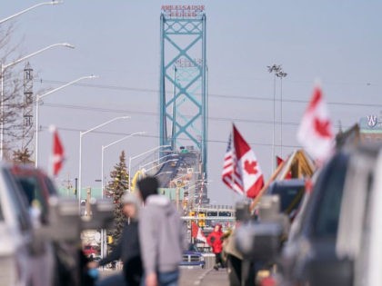 Freedom Convoy protesters block the roadway at the Ambassador Bridge border crossing with