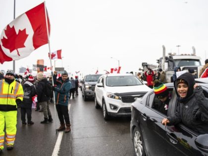 Protestors show their support for the Freedom Convoy of truck drivers who are making their way to Ottawa to protest against COVID-19 vaccine mandates by the Canadian government on Thursday, Jan. 27, 2022, in Vaughan.