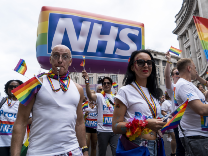 NHS workers from the Lesbian, Gay, Bisexual and Transgender (LGBT) community take part in the annual Pride Parade in London on July 6, 2019. (Photo by Niklas HALLE'N / AFP) (Photo credit should read NIKLAS HALLE'N/AFP via Getty Images)