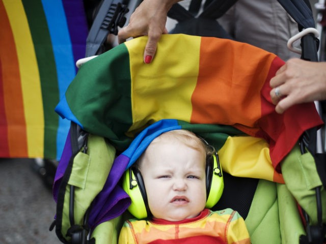 A child wearing ear protection gear attends the HBTQ festival "Stockholm Pride" parade on August 6, 2011 in central Stockholm. AFP PHOTO / JONATHAN NACKSTRAND (Photo by Jonathan NACKSTRAND / AFP) (Photo by JONATHAN NACKSTRAND/AFP via Getty Images)