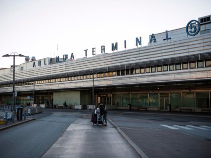A passanger walks outside the international terminal of Arlanda airport, north of Stockholm, on March 16, 2020, where air traffic slowed down due to the spread of the novel coronavirus COVID-19. (Photo by Jonathan NACKSTRAND / AFP) (Photo by JONATHAN NACKSTRAND/AFP via Getty Images)