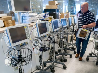 An engineer services and tests monitors for respiratory equipment at The Drager Company at Zoetermeer on the outskirts of Rotterdam on March 31, 2020, as the spread of the COVID-19 (novel coronavirus) has led to a shortage in the Netherlands of respiratory equipment. (Photo by Jerry LAMPEN / ANP / …
