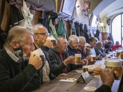 PRAGUE, CZECH REPUBLIC - MAY 25: Members of public gather at a reopened restaurant called Golden Tyger on May 25, 2020 in Prague, Czech Republic. The bars, restaurants and cafes are returning to full service in the Czech Republic as the government is taking further steps to ease its restrictive …