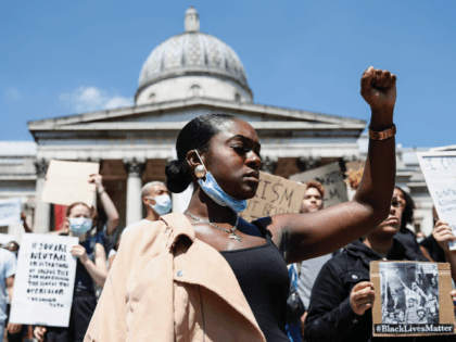 LONDON, ENGLAND - MAY 31: People hold placards as they join a spontaneous Black Lives Matter march at Trafalgar Square to protest the death of George Floyd in Minneapolis and in support of the demonstrations in North America on May 31, 2020 in London, England. The death of an African-American …