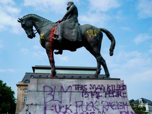 A picture taken on June 10, 2020 shows the vandalised statue of King Leopold II of Belgium