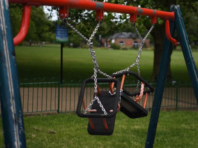 A picture shows swings tied up in a children's playground in the Highfields area of Leicester, central England on July 17, 2020, as local lockdown restrictions remain in force due to a spike in cases of the novel coronavirus in the city. - Boris Johnson said on July 17 he …