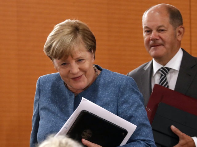 BERLIN, GERMANY - AUGUST 12: German Chancellor Angela Merkel (L) and Finance minister, Olaf Scholz (R) arrive for a cabinet meeting at the German chancellery on August 12, 2020 in Berlin, Germany. (Photo by Felipe Trueba - Pool/Getty Images)