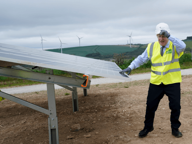 NEWQUAY, ENGLAND - JUNE 09: UK prime minister Boris Johnson visits the Scottish Power Carland Cross Windfarm on June 9, 2021 in Newquay, Cornwall, England. UK prime minister Boris Johnson visited the company on Wednesday to view new construction on a solar farm. (Jon Super - WPA Pool/Getty Images)
