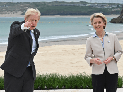President of the European Commission Ursula von der Leyen (R) is greeted by Britain's Prime Minister Boris Johnson at the start of the G7 summit in Carbis Bay, Cornwall on June 11, 2021. - G7 leaders from Canada, France, Germany, Italy, Japan, the UK and the United States meet this …