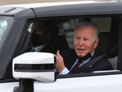 US President Joe Biden test drives an electric hummer as he tours the General Motors Factory ZERO electric vehicle assembly plant in Detroit, Michigan on November 17, 2021. (Photo by MANDEL NGAN / AFP) (Photo by MANDEL NGAN/AFP via Getty Images)