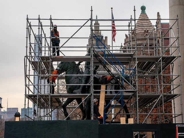 NEW YORK, NY - DECEMBER 02: Construction workers erect scaffolding around the President Theodore Roosevelt statue at the American Museum of Natural History as it is prepared for removal on December 2, 2021 in New York City. The American Museum of Natural History has requested that the City of New York and Mayor Bill de Blasio remove the statue as part of a movement to remove racist monuments across the country. In a statement, the museum added that the statue itself communicates a racial hierarchy that the museum and members of the public have long found disturbing.(Photo by David Dee Delgado/Getty Images)