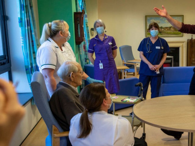 Britain's Prince William, Duke of Cambridge (2R) and his wife Britain's Catherine, Duchess of Cambridge (R), meet 94-year-old patient William Taylor (2L) during their visit to Clitheroe Community Hospital in north east England on January 20, 2022, to hear about the experiences of staff and patients during the Covid-19 pandemic. …