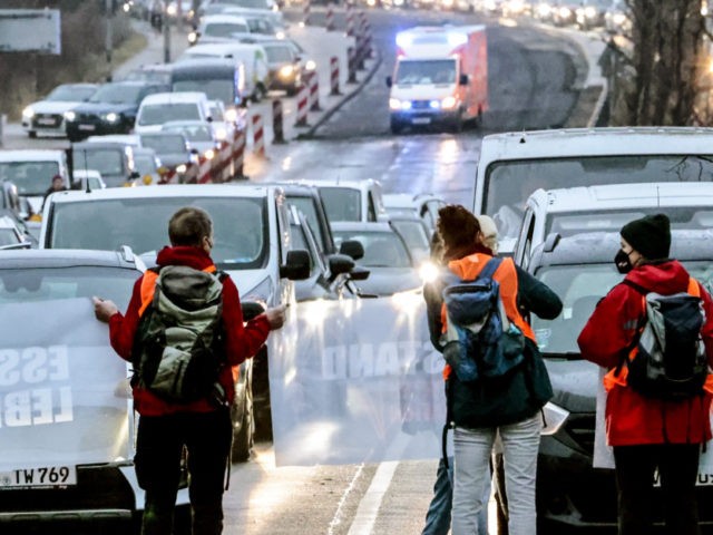BERLIN, GERMANY - JANUARY 24: Activists block the end of a highway to protest against food