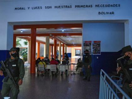 Members of the National Bolivarian Armed Forces of Venezuela guard a signature collection