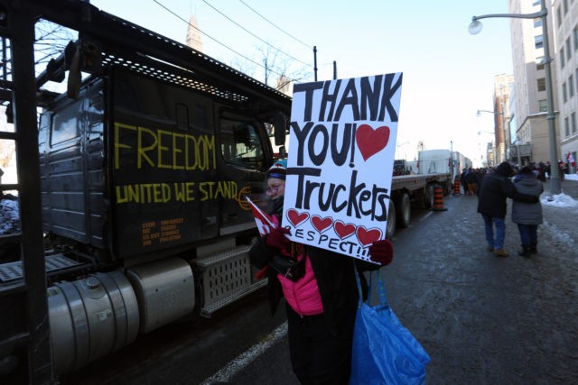 Supporters of the Freedom Convoy protest Covid-19 vaccine mandates and restrictions in fr