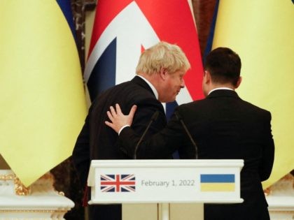 Ukrainian President Volodymyr Zelenskiy interacts with British Prime Minister Boris Johnson at a joint conference in Kyiv on February 1, 2022. (Photo by PETER NICHOLLS / POOL / AFP) (Photo by PETER NICHOLLS/POOL/AFP via Getty Images)