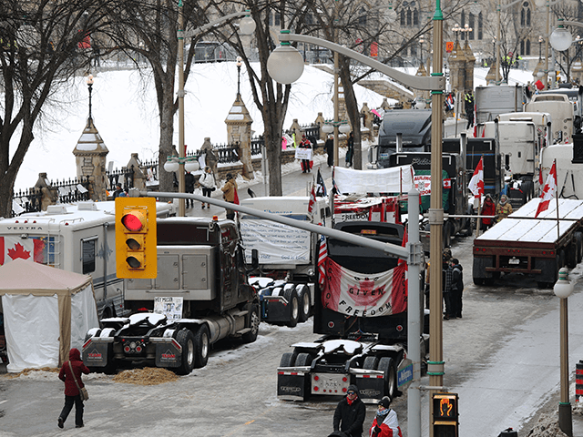 Trucks are parked on Wellington street as demonstrators continue to protest the vaccine mandates implemented by Prime Minister Justin Trudeau on February 9, 2022 in Ottawa, Canada. (Photo by Dave Chan / AFP) (Photo by DAVE CHAN/AFP via Getty Images)