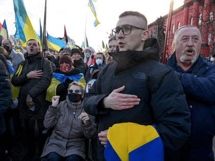 Demonstrators sing the Ukranian national anthem as they take part in a rally in Kyiv on Fe