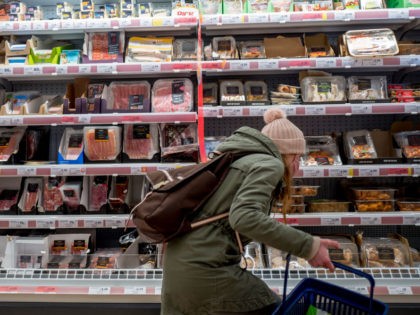 A customer shops for meat at a Sainsbury's supermarket in Walthamstow, east London on February 13, 2022. - UK annual inflation struck 5.4 percent in December, stoking fears of a cost-of-living squeeze as wages fail to keep pace. (Photo by Tolga Akmen / AFP) (Photo by TOLGA AKMEN/AFP via Getty …