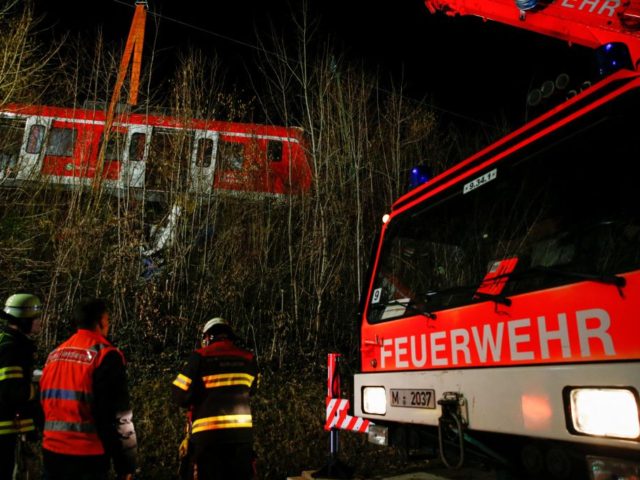 Members of the emergency services work at the scene of an S-bahn commuter train accident w