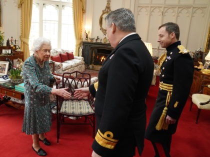 WINDSOR, ENGLAND - FEBRUARY 16: Queen Elizabeth II speaks with Rear Admiral James Macleod (right) and Major General Eldon Millar as she meets the incoming and outgoing Defence Service Secretaries during an in-person audience at Windsor Castle when she met the incoming and outgoing Defence Service Secretaries at Windsor Castle …