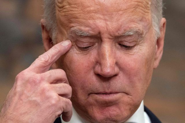 US President Joe Biden looks down as he delivers a national update on the situation at the