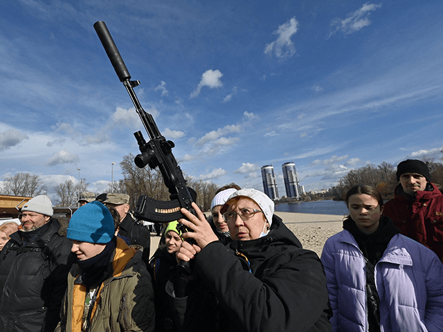 Residents attend an open training organised for civilians by war veterans and volunteers w