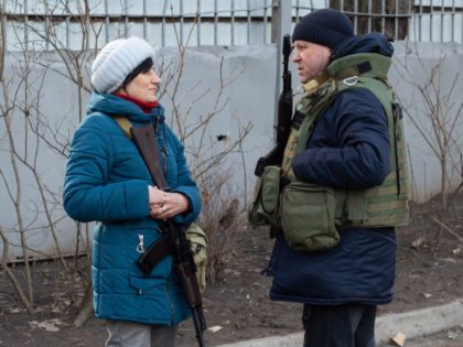 KYIV, UKRAINE - FEBRUARY 25: Members of the territorial defense are seen near the recruitment office in Kyiv on February 25, 2022, Ukraine. Yesterday, Russia began a large-scale attack on Ukraine, with Russian troops invading the country from the north, east and south, accompanied by air strikes and shelling. The …