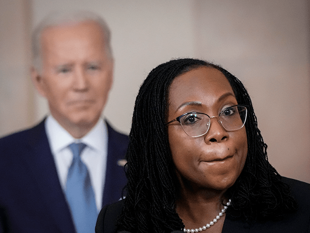 U.S. President Joe Biden (L) looks on as Ketanji Brown Jackson, circuit judge on the U.S. Court of Appeals for the District of Columbia Circuit, delivers brief remarks as his nominee to the U.S. Supreme Court during an event in the Cross Hall of the White House February 25, 2022 …